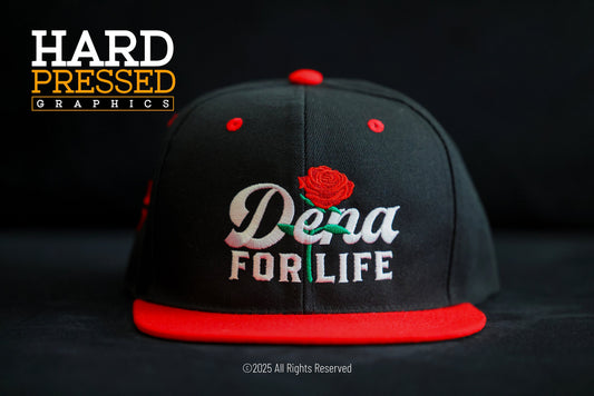 black dena for life hat with red rose and text