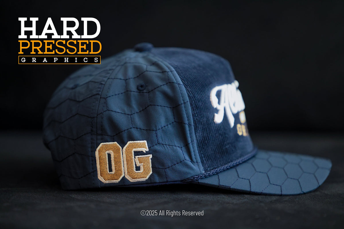 Quilted navy blue OG Altadena hat with white and gold lettering